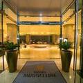 Exterior of Grand Millennium Muscat Apartments and Suites connected to Mall