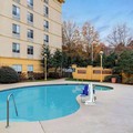 Swimming pool at La Quinta Inn & Suites by Wyndham Raleigh / Durham Southpoint