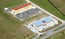 Aerial View Hotel & Strip Mall 1 of 11